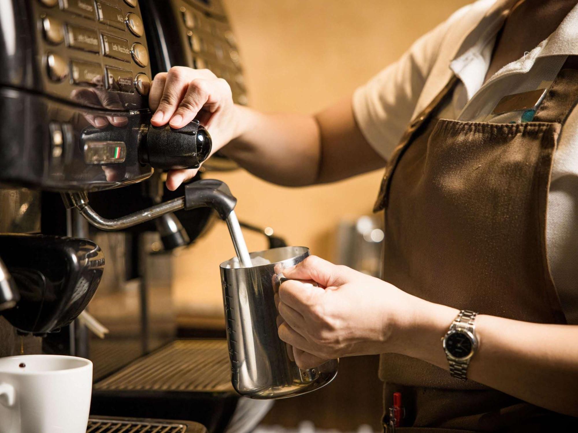Grand Mercure Phuket Patong Esterno foto A barista making espresso